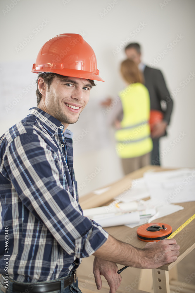 foreman during a meeting about a build project foreman during a meeting about a build project