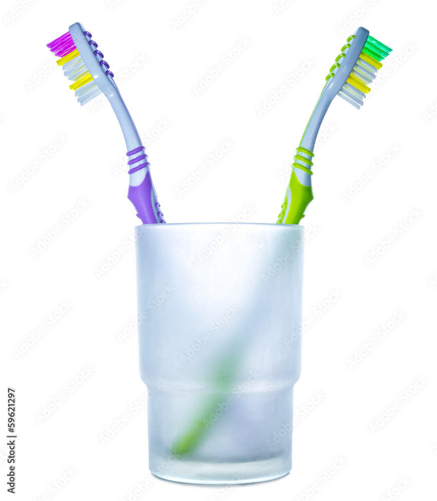 Disagreement: two colorful toothbrushes in glass Disagreement: two colorful toothbrushes in glass