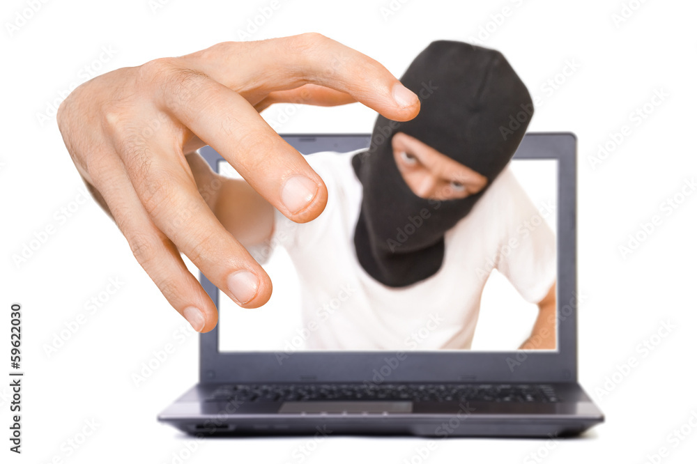 Man in black mask tries to grab the viewer from the screen Man in black mask tries to grab the viewer from the screen