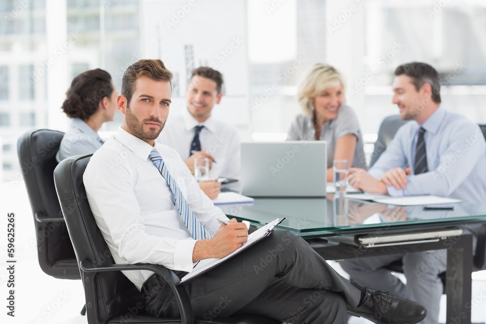 Businessman with colleagues discussing in office Businessman with colleagues discussing in office