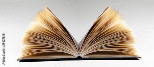 Close-up of an open book, on gray background