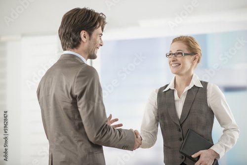 Business woman welcoming a partner