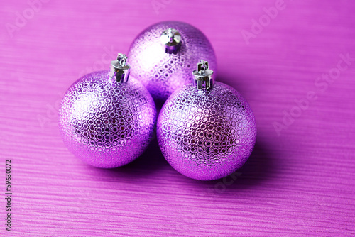 Christmas balls on purple background