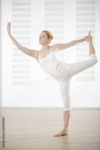 young woman practicing exercises easing