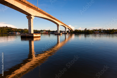Reflection of a bridge with blue sky at Sabah, Borneo, Malaysia © macbrianmun