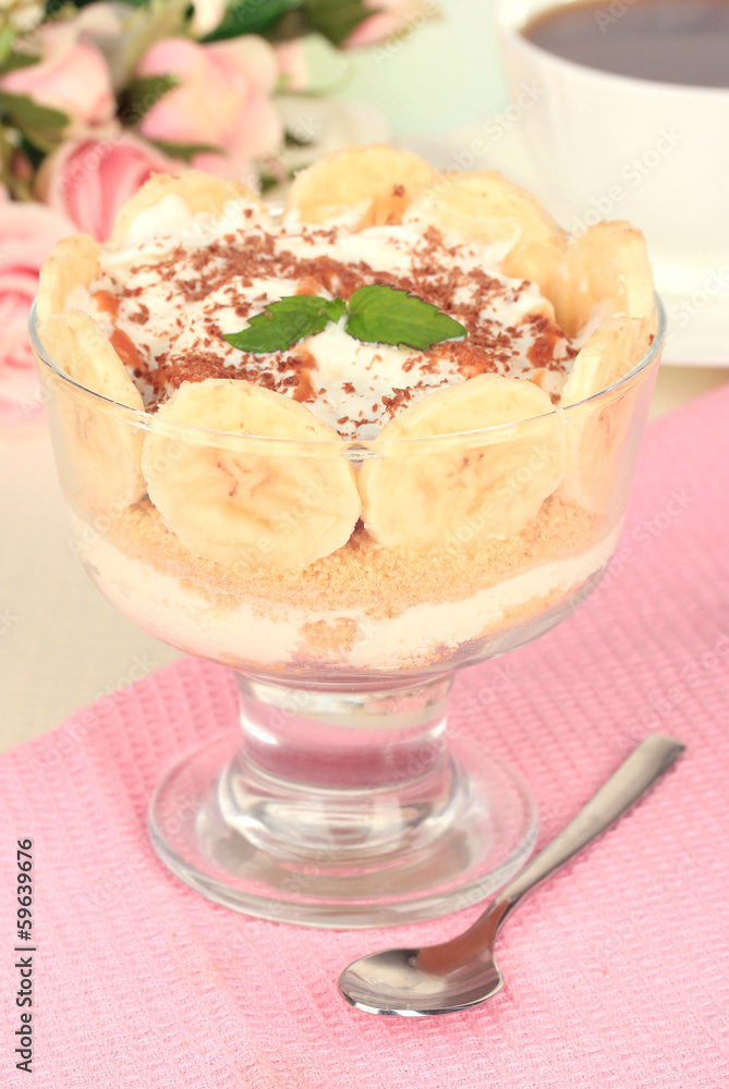 Delicious dessert with banana and caramel on table close-up Delicious dessert with banana and caramel on table close-up