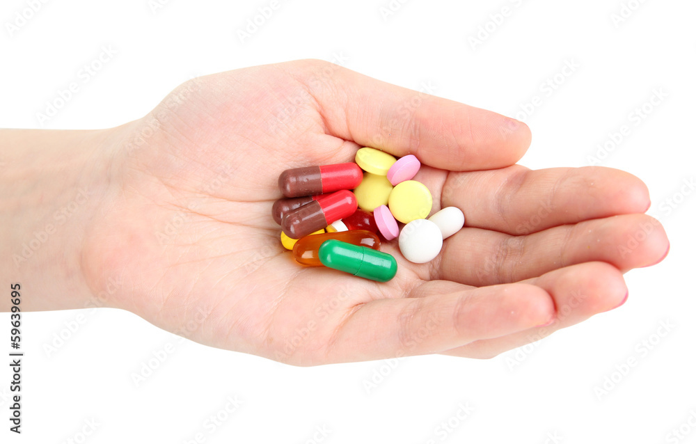 Pills in hand isolated on white Pills in hand isolated on white