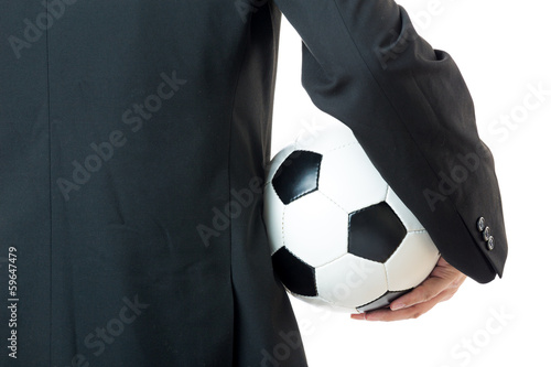 Fototapeta Naklejka Na Ścianę i Meble -  Businessman holding football