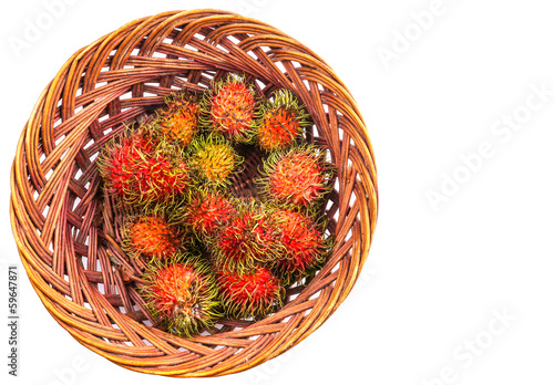 A bunch of rambutan in a wicker basket