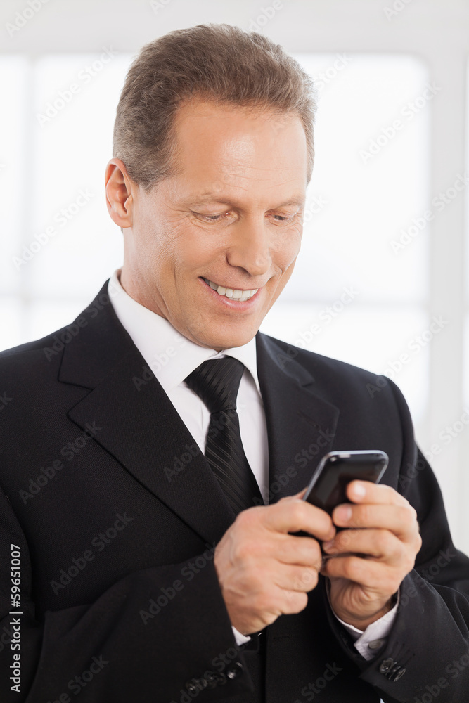 Businessman with mobile phone.