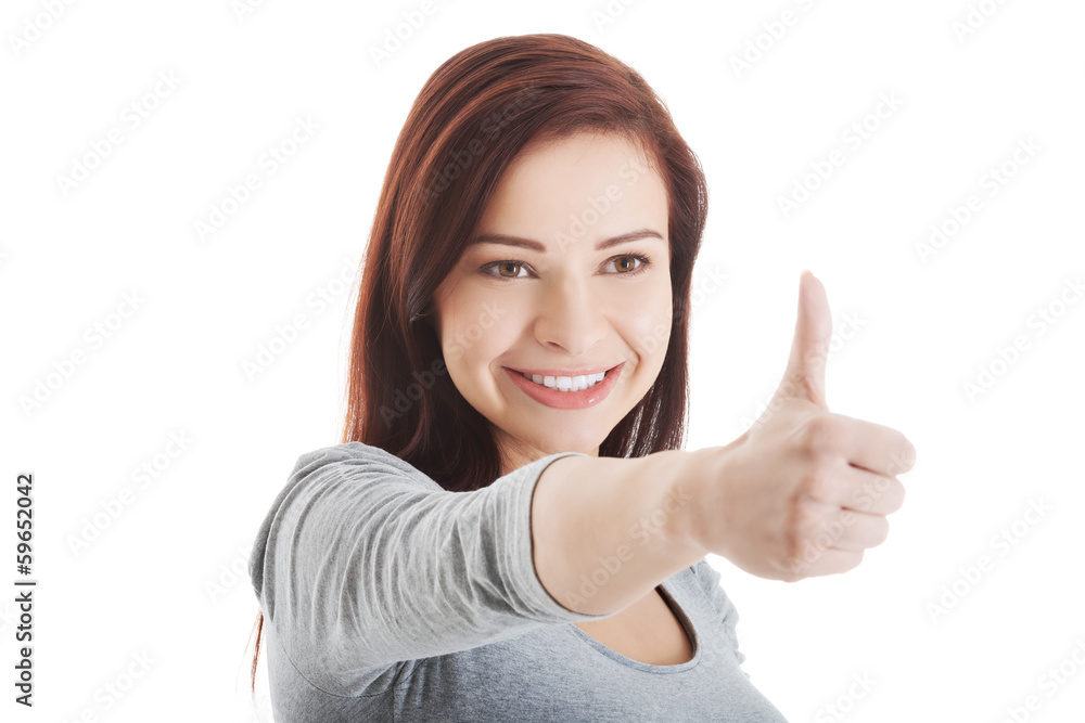 Beautiful young and casual girl is showing ok gesture. Beautiful young and casual girl is showing ok gesture.