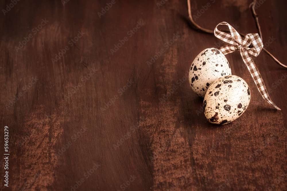 Easter background with quail eggs and little bow Easter background with quail eggs and little bow