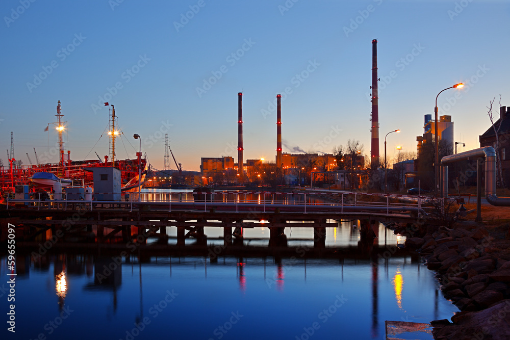 Industrial view - chimneys reflection on the water.