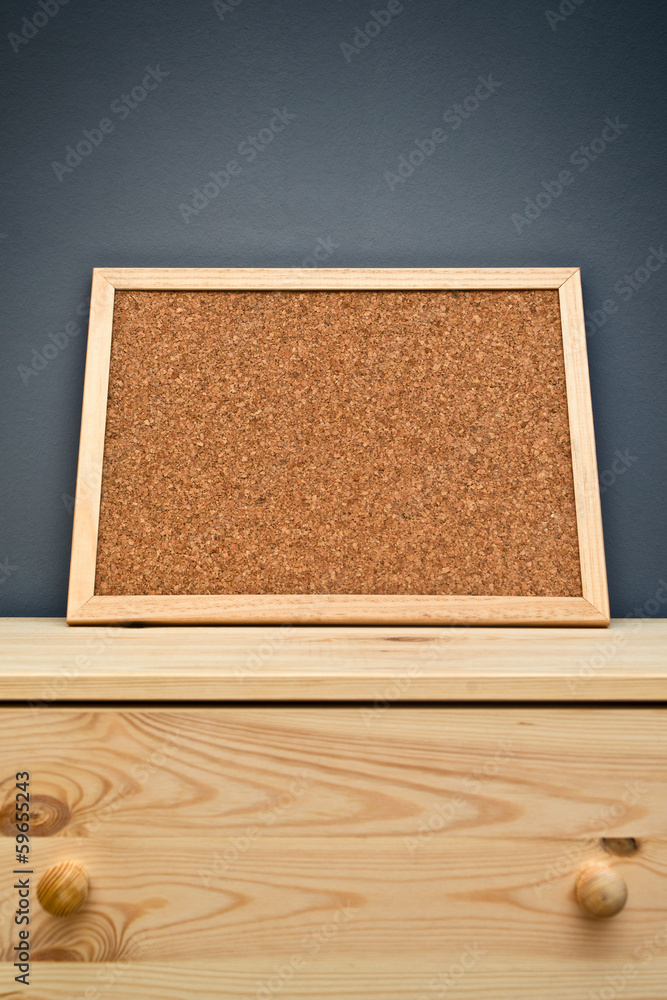 Fototapeta premium Cork memory board on wooden cabinet