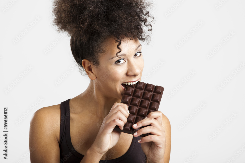 Woman eating chcolate Woman eating chcolate