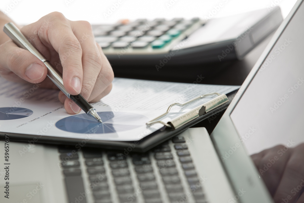 Businessman analyzing investment charts Businessman analyzing investment charts