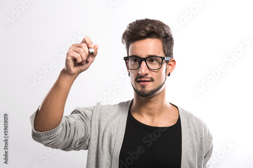 Young man writing on a glass