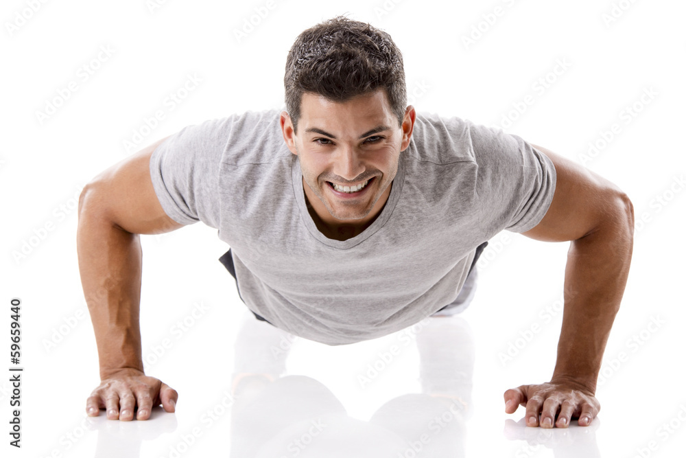 Handsome young man making pushups - obrazy, fototapety, plakaty 