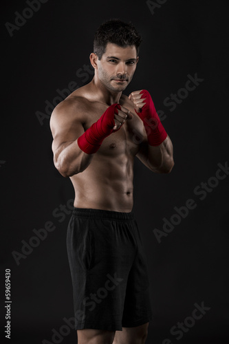 Man practicing body combat © ikostudio