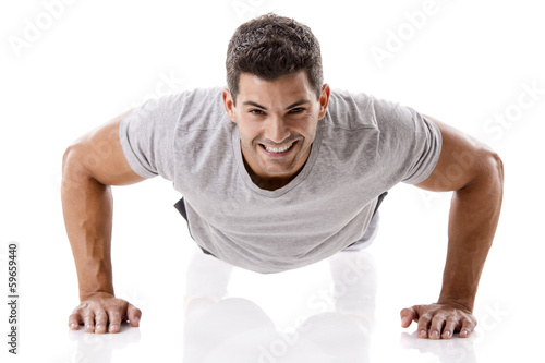 Canvastavla Handsome young man making pushups