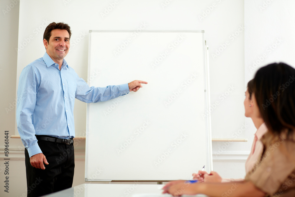 Professional handsome man pointing at whiteboard Professional handsome man pointing at whiteboard