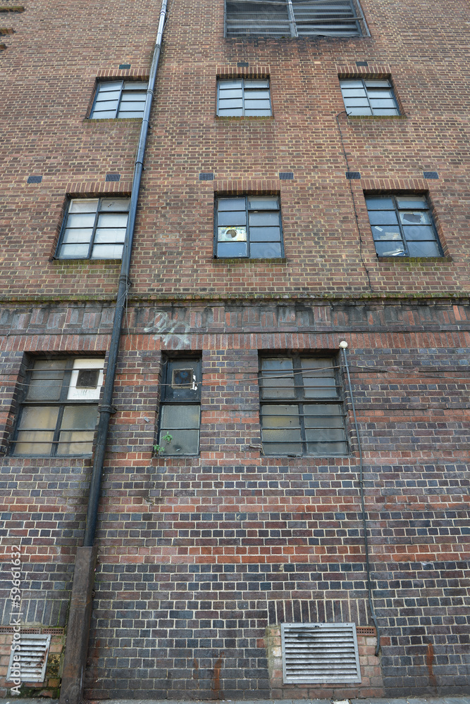 Naklejka premium Classic brick wall with glass windows
