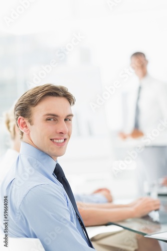 Wallpaper Mural Happy businessman looking at camera during a meeting Torontodigital.ca