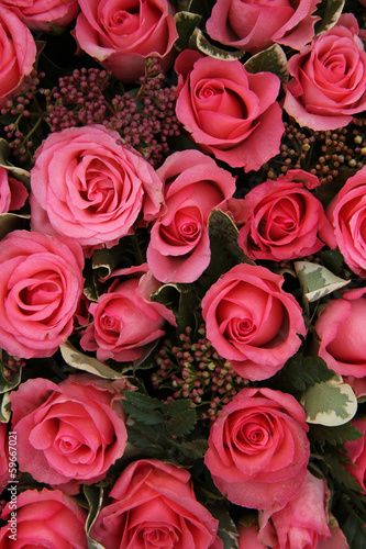 Skimmia and pink roses bridal arrangement