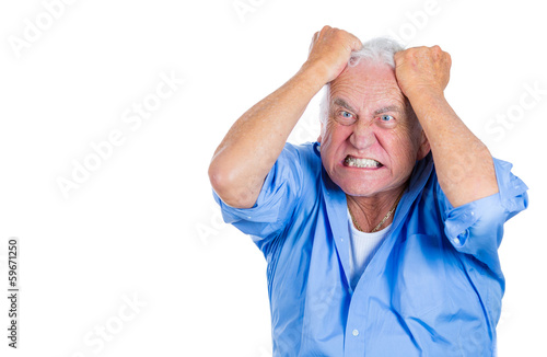 Stressed old man pulling out his hair, completely desperate