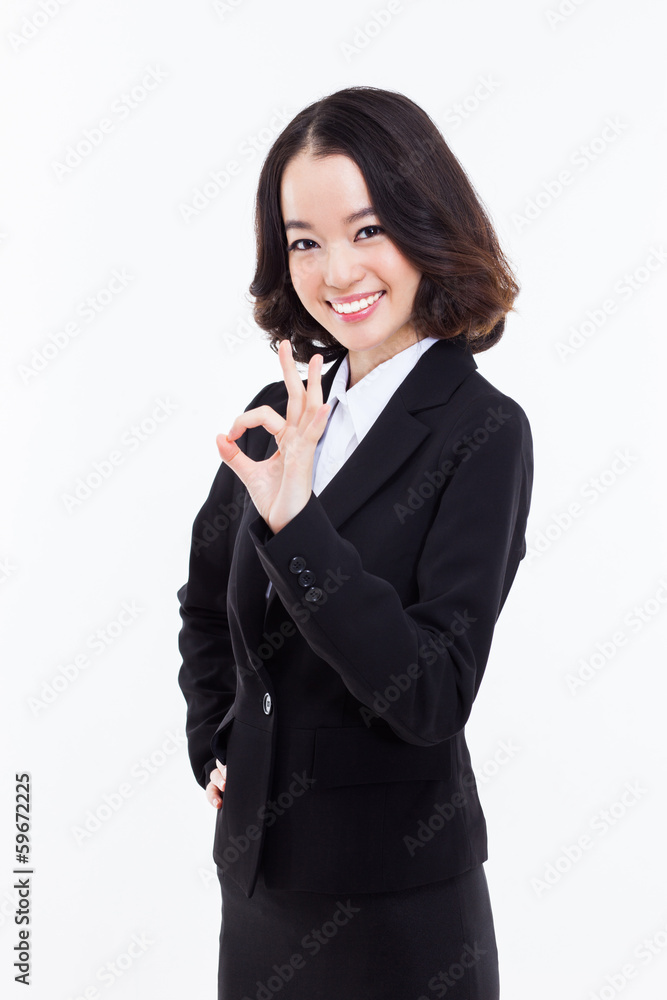 Young Asian business woman showing okay sign Young Asian business woman showing okay sign