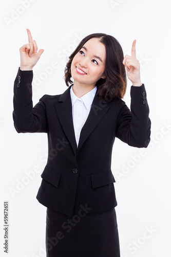 Young business woman point up side