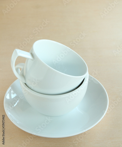 Cup of coffee on wooden board