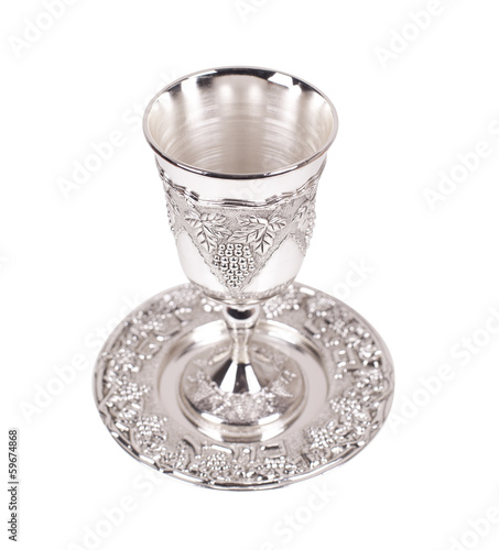 Silver kiddush wine cup and saucer on a white background photo