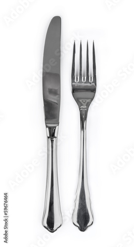 Knife and fork isolated on white background photo