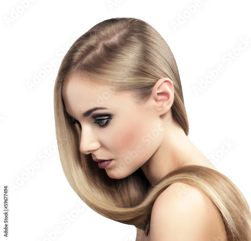 Natural straight hair model posing in studio, isolated