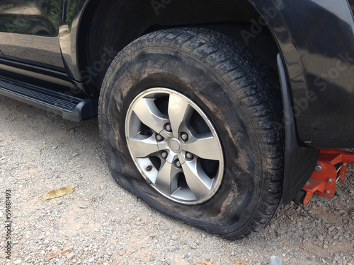 Torn tyre  of the black van © goodapp
