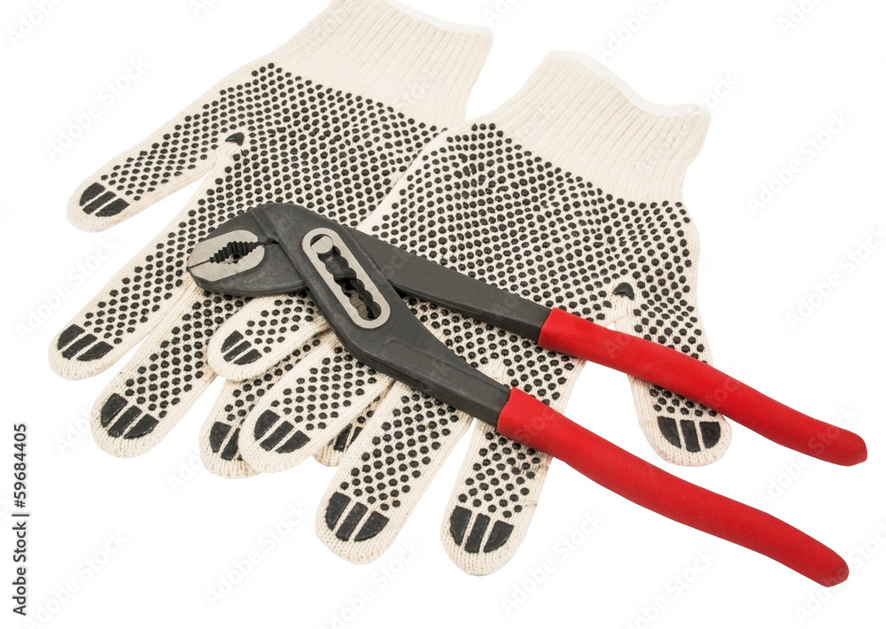 Dirty leather gloves and pliers Dirty leather gloves and pliers