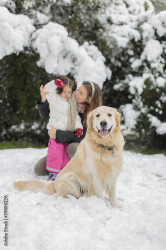 Family with a dog at winter