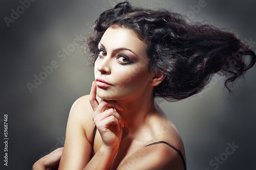 beautiful young female model with a wicked hairstyle