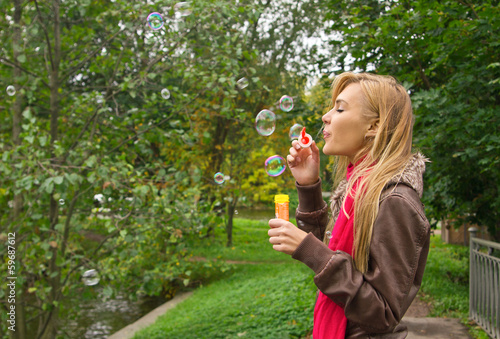 Woman blowing bubbles