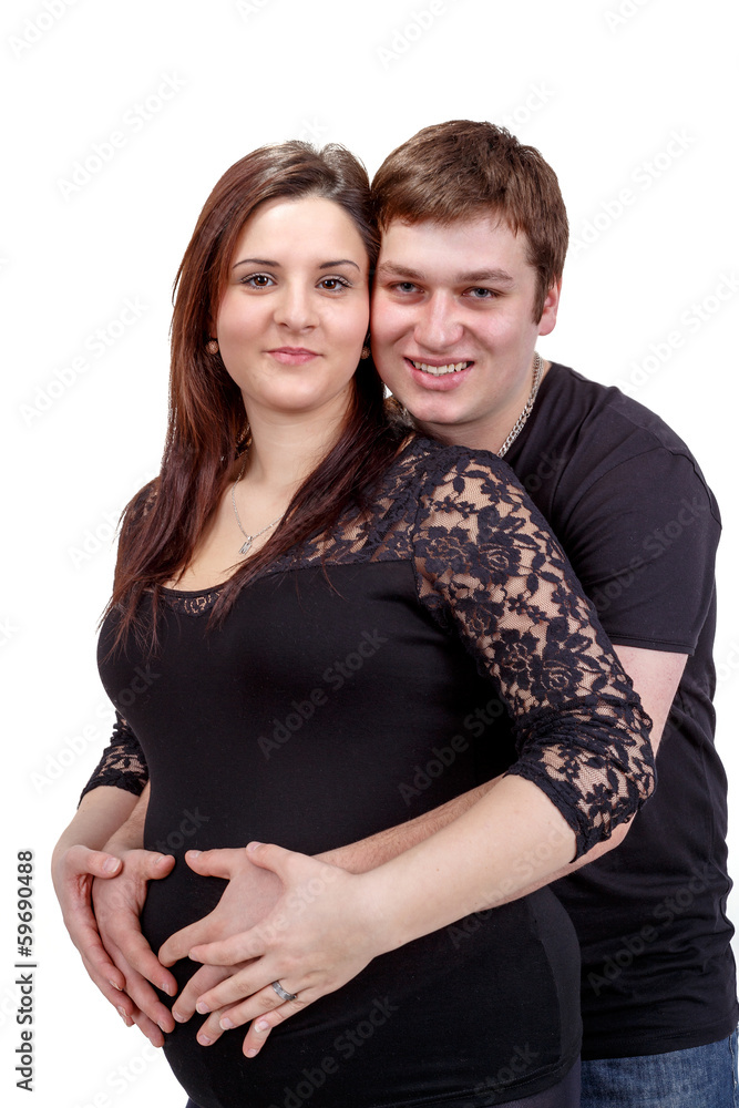 loving happy couple, pregnant woman with her husband, isolated o loving happy couple, pregnant woman with her husband, isolated o