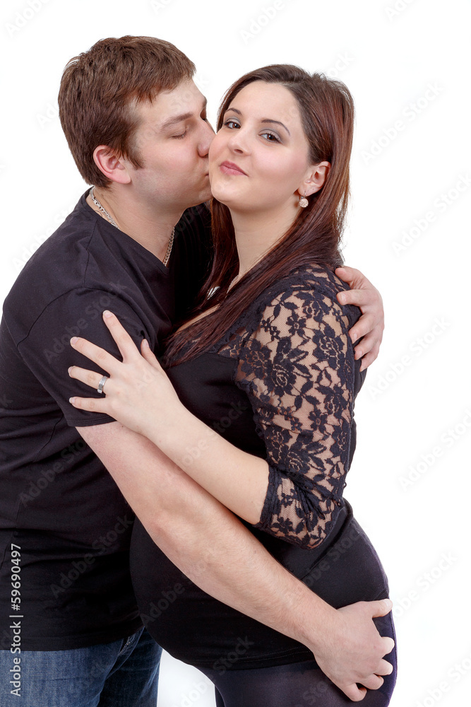 loving happy couple, husband kissing pregnant woman loving happy couple, husband kissing pregnant woman