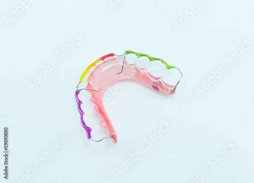 Retainer and brace on white background photo