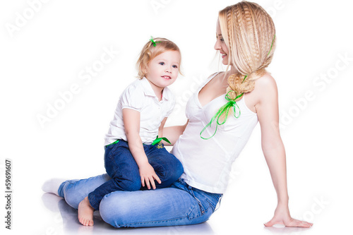 closeup portrait of young mother hug her little daughter