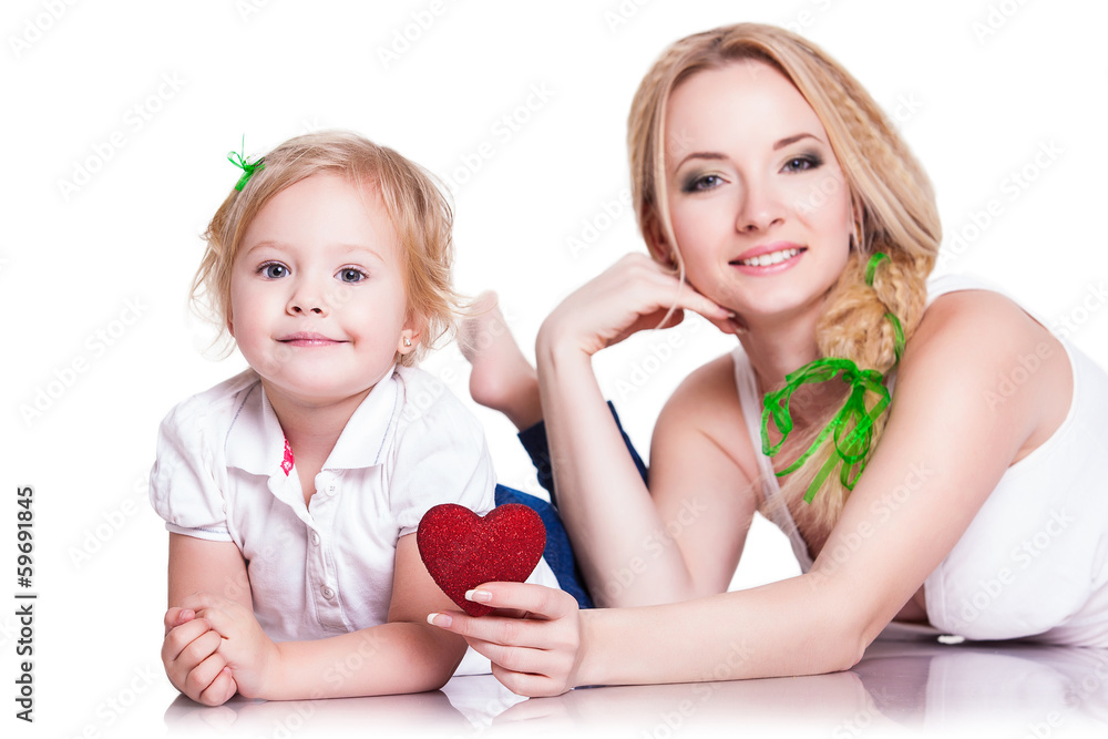 portrait of young mother and little daughter holding heart portrait of young mother and little daughter holding heart