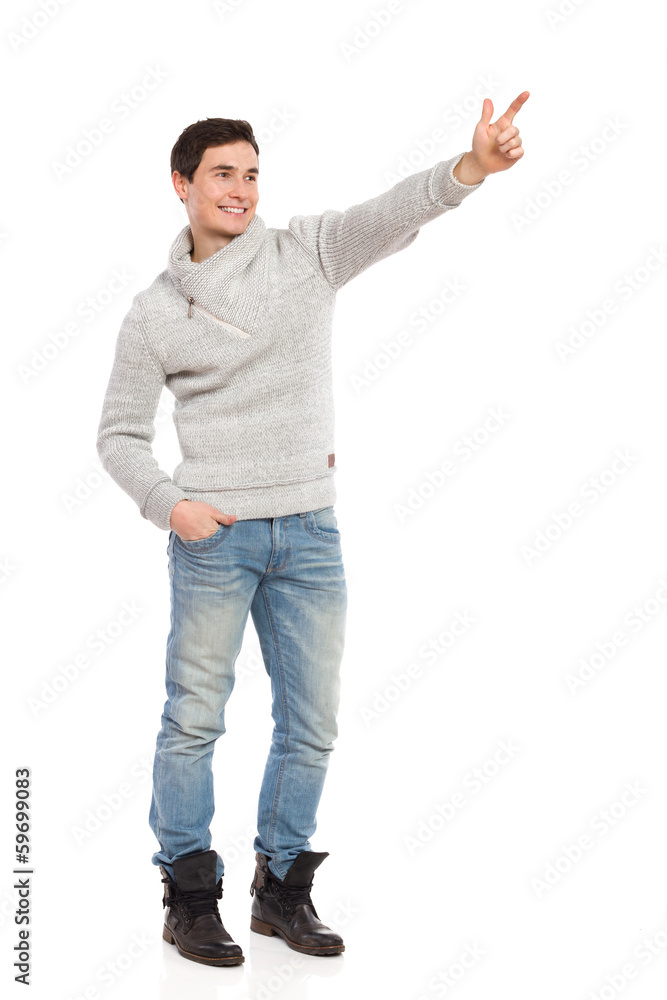 Young man pointing. Young man pointing.