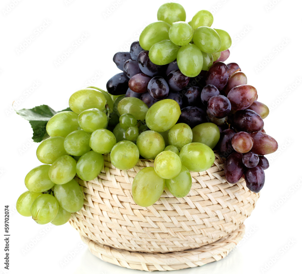 Ripe green and purple grapes in basket isolated on white Ripe green and purple grapes in basket isolated on white