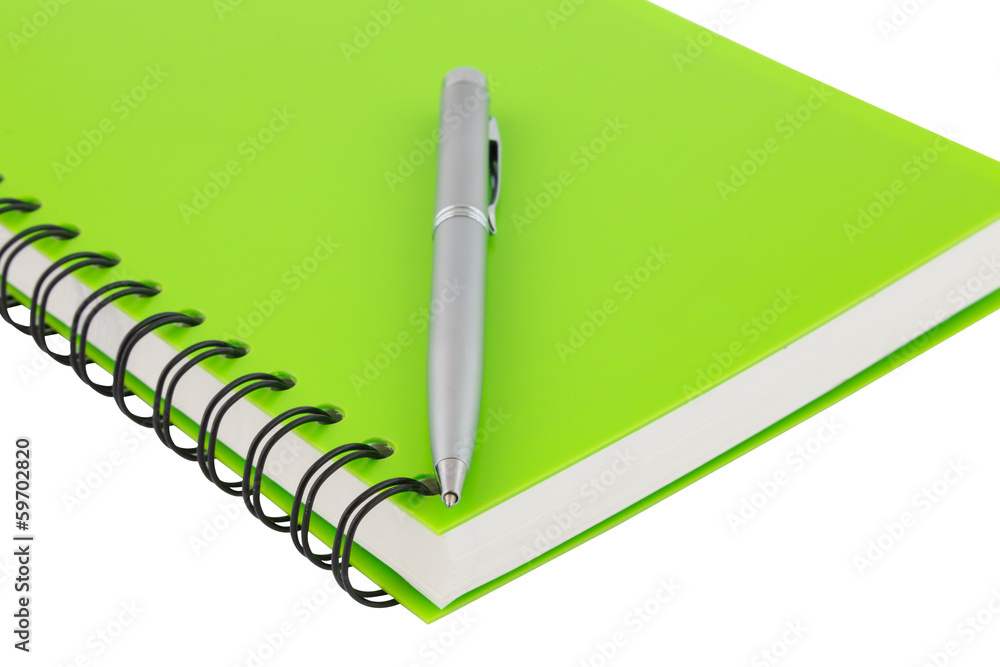 close up notebook spiral bound and pen on white background close up notebook spiral bound and pen on white background