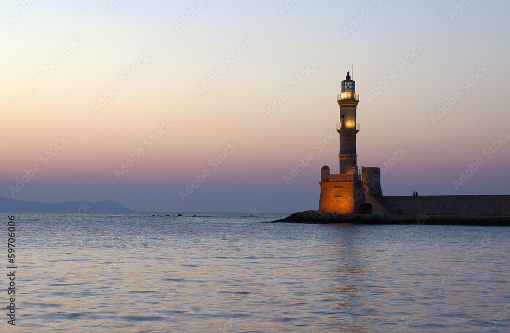 Lighthouse in the old port in the evening, Chania, Crete.