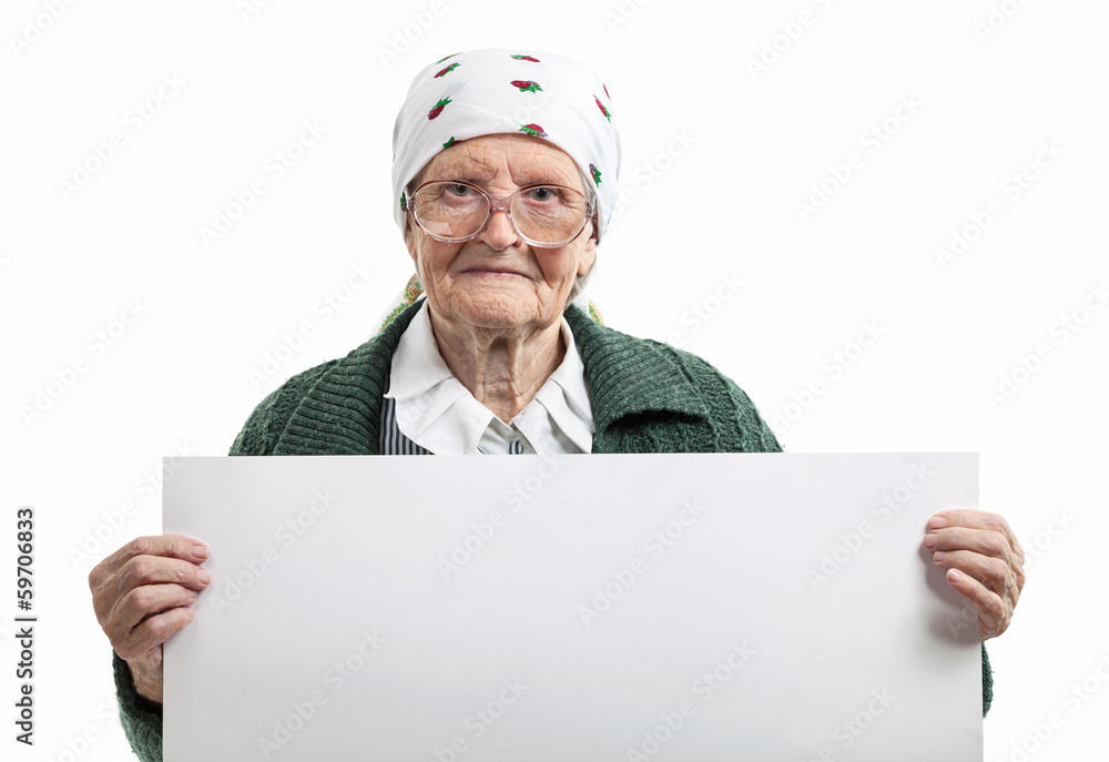 Smiling elderly lady holding blank sheet in hands over white Smiling elderly lady holding blank sheet in hands over white